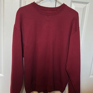 Long sleeved, dark red sweater